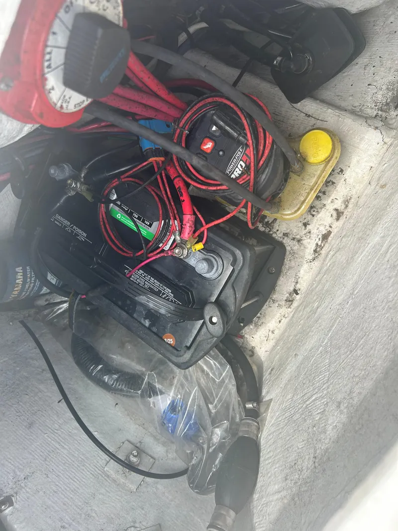Slide: The Image of Battery compartment with wiring in a 2001 Concept 23 CC boat. - 22