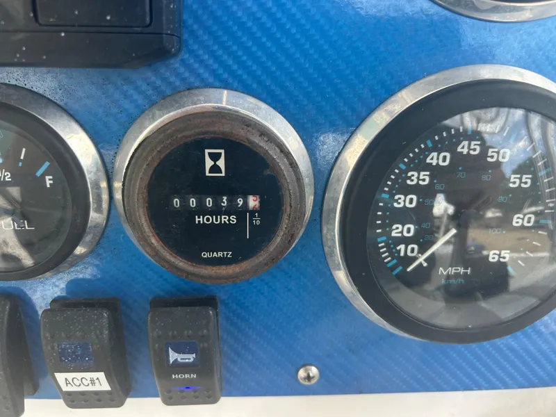 Slide: The Image of Dashboard of a 2001 Concept 23 CC with gauges and switches. - 25