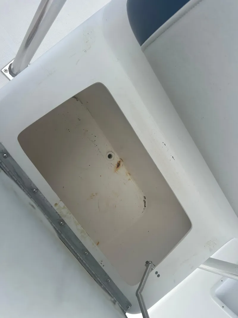 Slide: The Image of White compartment interior of a 2001 Concept 23 CC boat. - 26