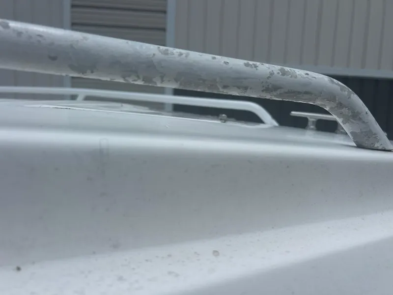 Slide: The Image of Close-up of a weathered metal railing on a Concept 23 CC, 2001 model. - 29