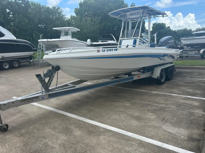 Slide: The Image of 2001 Concept 23 CC boat on Loadmaster trailer in parking lot. - 3