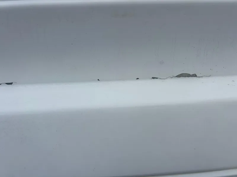 Slide: The Image of Close-up of chipped white paint on Concept 23 CC, 2001 model. - 30