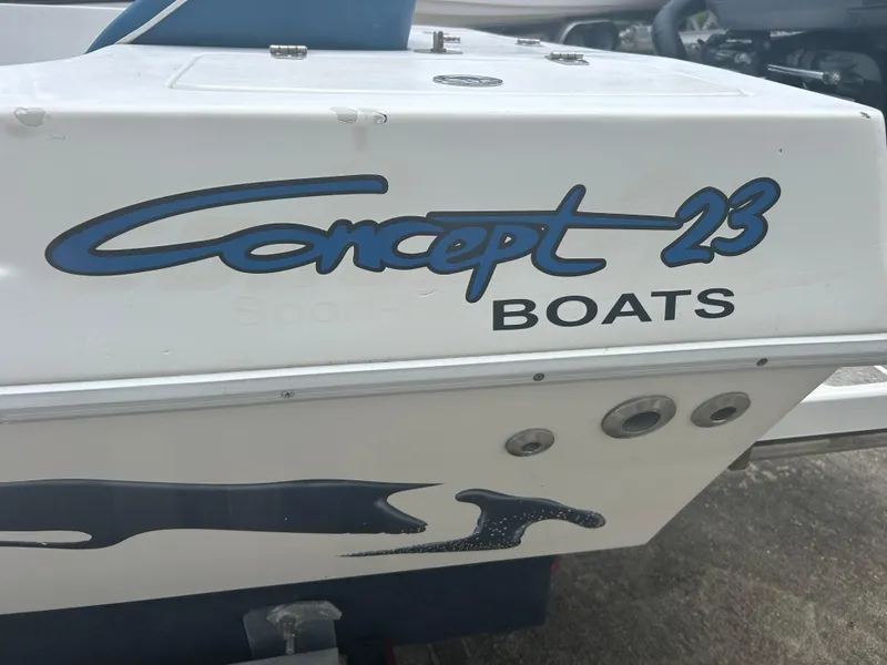 Slide: The Image of Concept 23 CC 2001 boat logo on white surface, featuring blue and black text. - 32