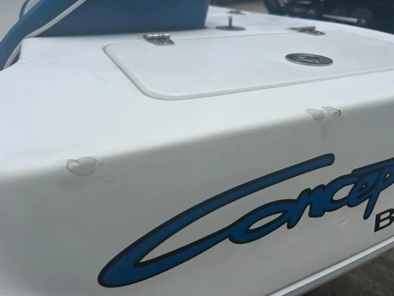 Slide: The Image of Close-up of 2001 Concept 23 CC boat with visible paint chips. - 33