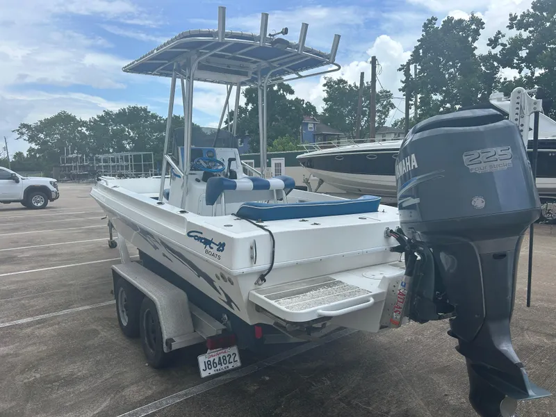 Slide: The Image of 2001 Concept 23 CC boat with Yamaha 225 engine on trailer in parking lot. - 4