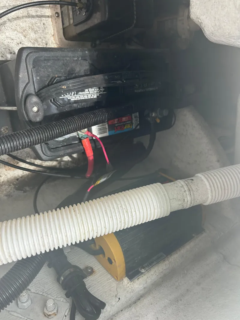 Slide: The Image of Battery and wiring inside a 2001 Concept 23 CC boat compartment. - 9