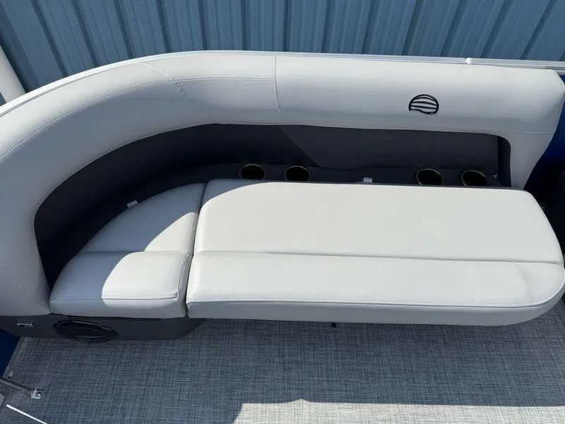 Slide: The Image of 2026 Sun Tracker PARTY BARGE® 16 DLX boat seating with cup holders, gray upholstery. - 2