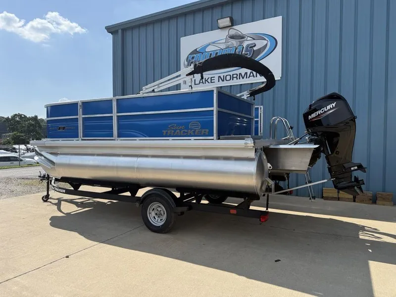 Slide: The Image of 2026 Sun Tracker PARTY BARGE® 16 DLX pontoon boat with Mercury outboard motor. - 4