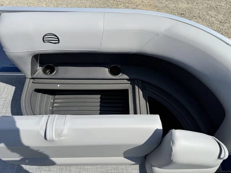 Slide: The Image of 2026 Sun Tracker PARTY BARGE® 16 DLX interior with gray seating and cup holders. - 5