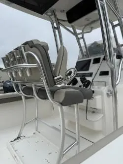 Slide: The Image of 2025 Key West 239 FS boat interior with sleek seating and modern controls. - 2