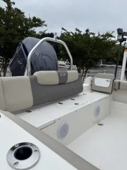 Slide: The Image of 2025 Key West 239 FS boat interior with seating and engine view. - 3