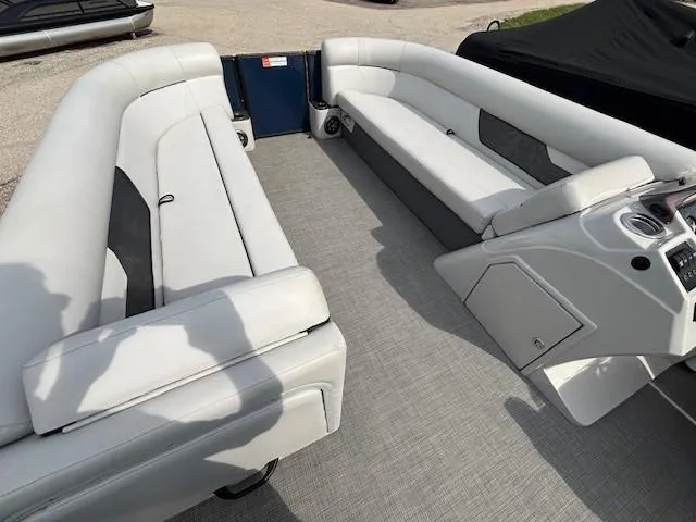 Slide: The Image of 2020 Crest Classic DLX 240 SLC pontoon boat interior with spacious seating and modern design. - 13