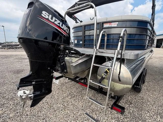 Slide: The Image of 2020 Crest Classic DLX 240 SLC pontoon boat with Suzuki outboard motor and ladder. - 15