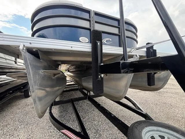 Slide: The Image of 2020 Crest Classic DLX 240 SLC pontoon boat on trailer, viewed from below. - 17