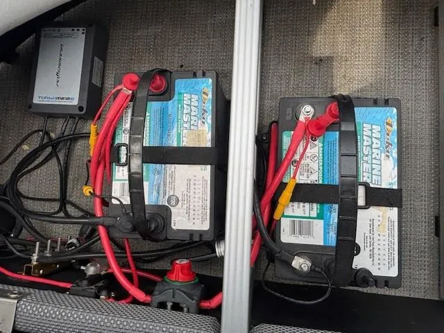 Slide: The Image of Batteries and wiring inside a 2020 Crest Classic DLX 240 SLC boat. - 19