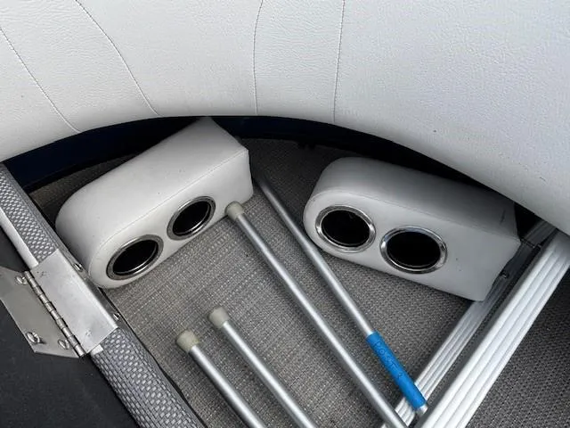 Slide: The Image of Interior of 2020 Crest Classic DLX 240 SLC boat with cup holders and metal poles. - 21