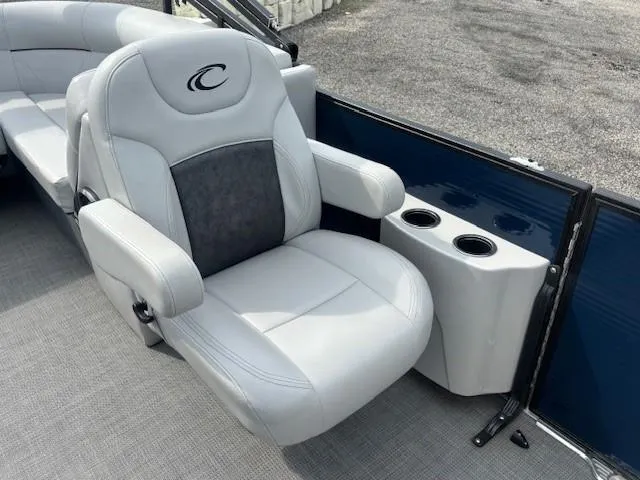 Slide: The Image of Luxurious seating on 2020 Crest Classic DLX 240 SLC pontoon boat with cup holders. - 24