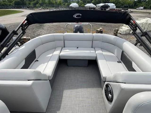 Slide: The Image of 2020 Crest Classic DLX 240 SLC pontoon boat with spacious seating and sleek design. - 6