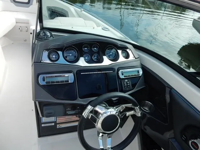 Slide: The Image of Dashboard of 2014 Monterey 288 Super Sport boat with steering wheel and gauges. - 38