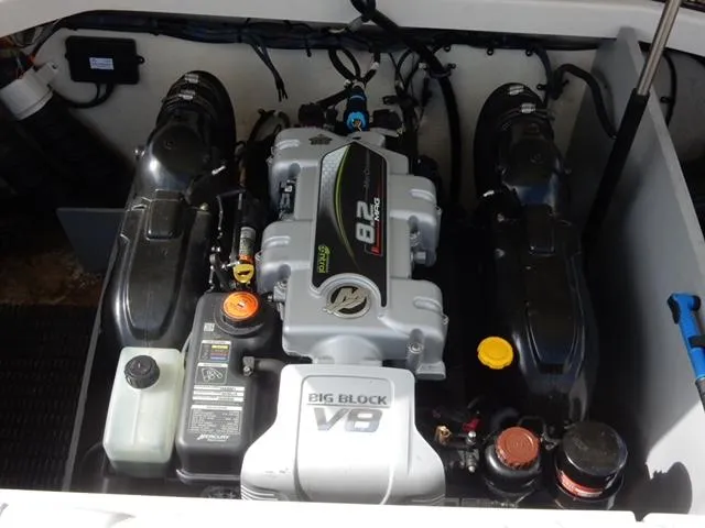 Slide: The Image of Engine compartment of a 2014 Monterey 288 Super Sport boat, featuring a Big Block V8 engine. - 4