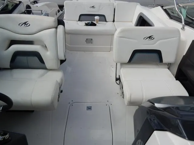 Slide: The Image of 2014 Monterey 288 Super Sport boat interior with white seating and logo detailing. - 41