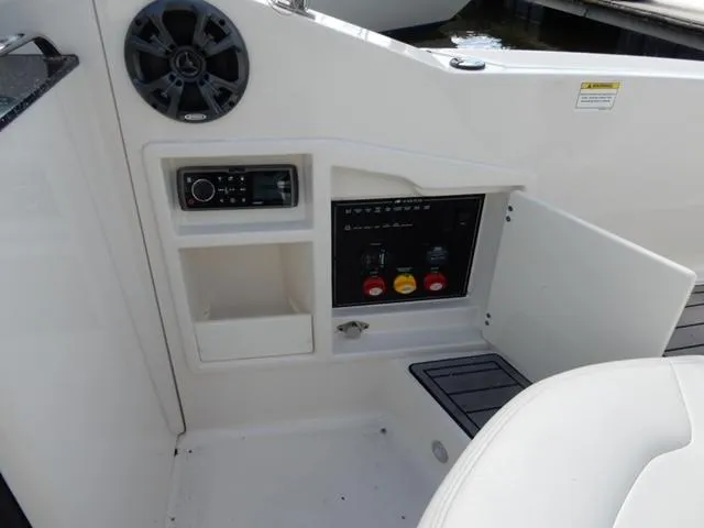 Slide: The Image of 2014 Monterey 288 Super Sport boat interior with control panel and speaker. - 45