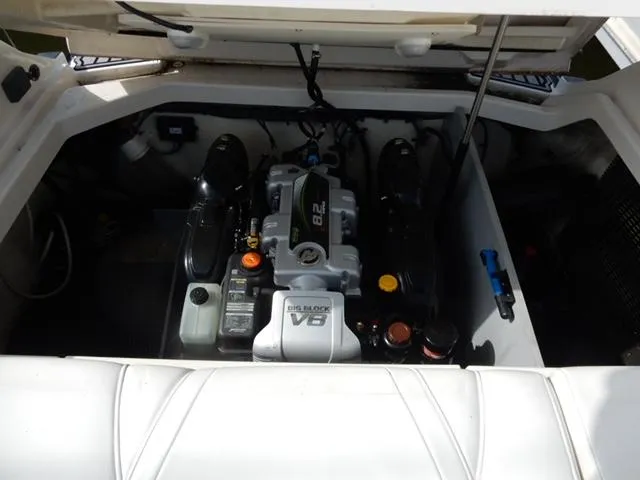 Slide: The Image of Engine compartment of 2014 Monterey 288 Super Sport boat, featuring a powerful V8 engine. - 47