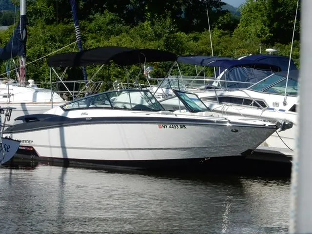 Slide: The Image of 2014 Monterey 288 Super Sport boat docked in a marina. - 6