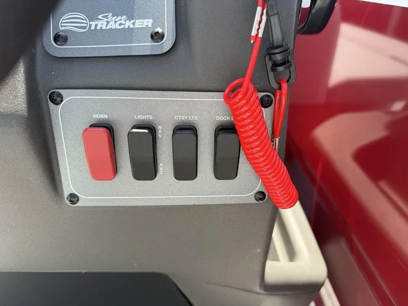 Slide: The Image of Control panel of 2026 Sun Tracker PARTY BARGE® 16 DLX with switches and safety lanyard. - 11
