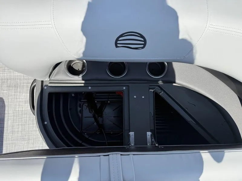 Slide: The Image of Interior storage compartment of 2026 Sun Tracker PARTY BARGE® 16 DLX with cup holders. - 15