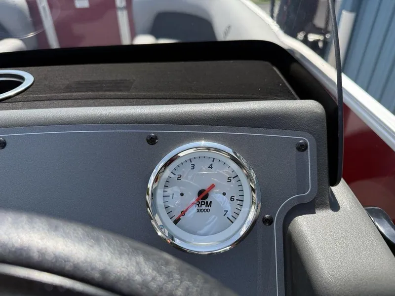Slide: The Image of Close-up of RPM gauge on 2026 Sun Tracker PARTY BARGE® 16 DLX dashboard. - 16