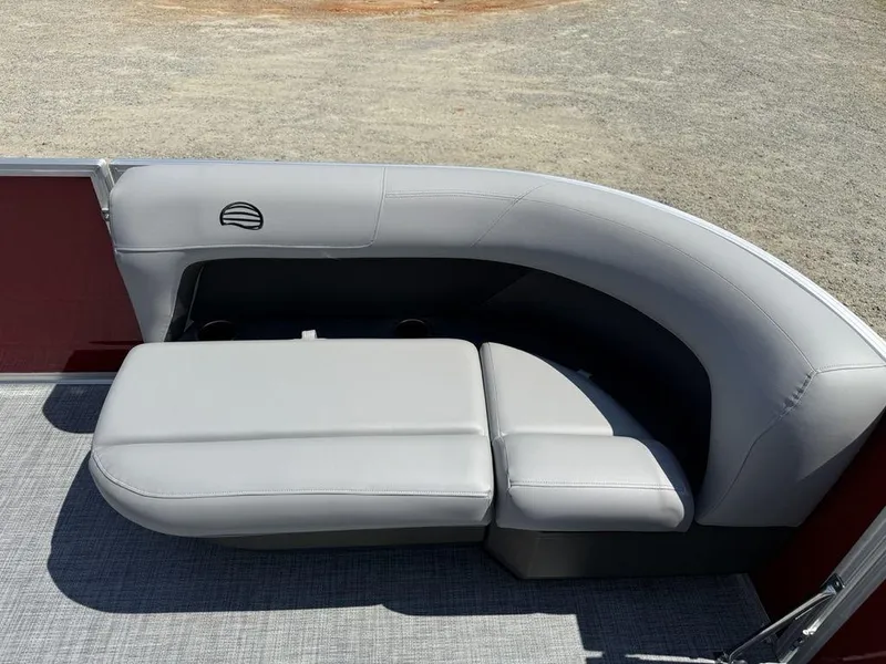 Slide: The Image of 2026 Sun Tracker PARTY BARGE® 16 DLX pontoon boat seating, featuring gray cushioned seats. - 5