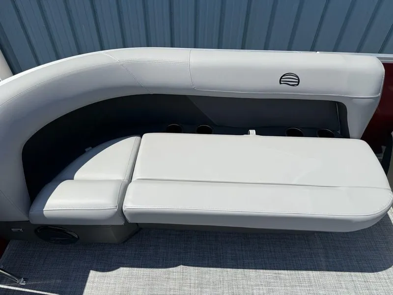 Slide: The Image of 2026 Sun Tracker PARTY BARGE® 16 DLX boat seating with gray upholstery and cup holders. - 6