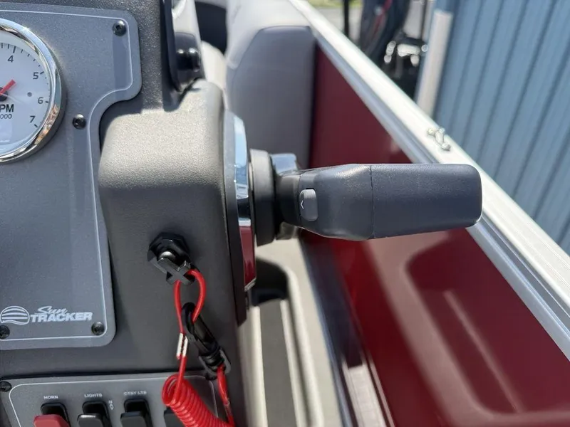 Slide: The Image of Close-up of 2026 Sun Tracker PARTY BARGE® 16 DLX control panel and throttle. - 9