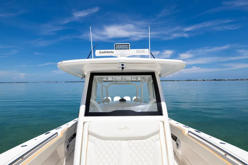 Slide: The Image of 2024 Blackwater 43 Sportfish boat on calm water with clear blue sky. - 18