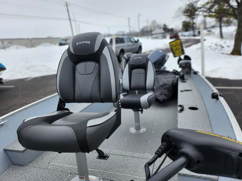 Slide: The Image of 2019 Lund 1600 Fury Tiller boat with seats, parked in snowy area. - 15