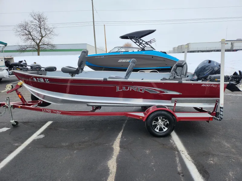 Slide: The Image of 2019 Lund 1600 Fury Tiller boat on trailer, parked outdoors in a lot. - 4