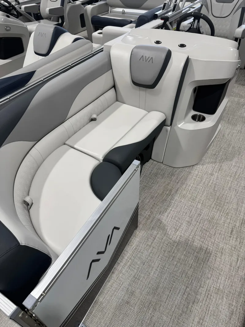 Slide: The Image of 2025 Avalon 2385 25 LSZ VRL boat interior with modern seating and steering console. - 2