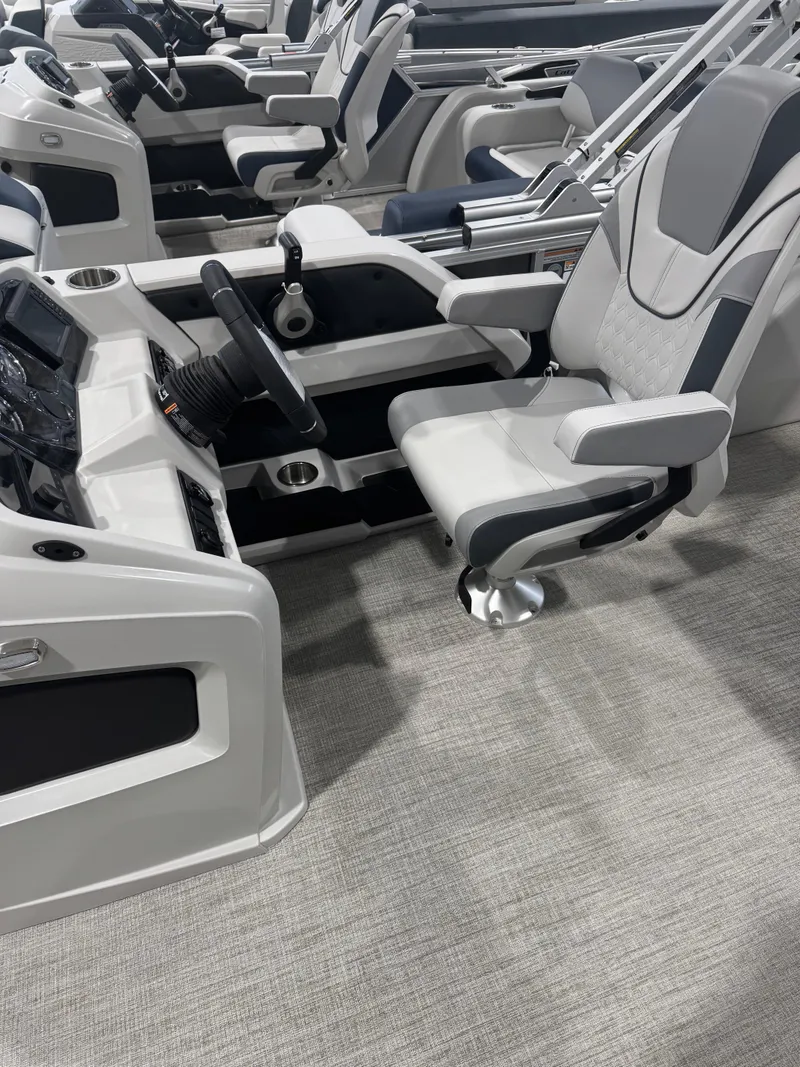 Slide: The Image of 2025 Avalon 2385 25 LSZ VRL boat interior with modern helm and comfortable seating. - 4