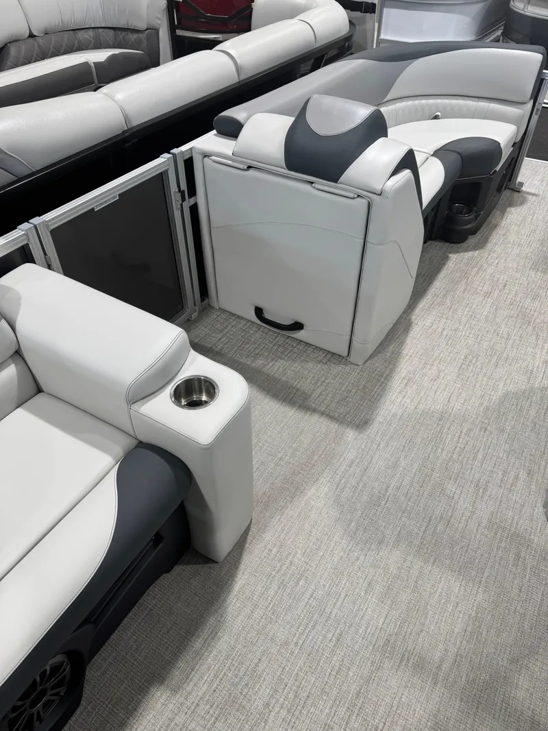 Slide: The Image of Luxurious seating on 2025 Avalon 2385 25 LSZ VRL pontoon boat, featuring sleek design and cup holder. - 6
