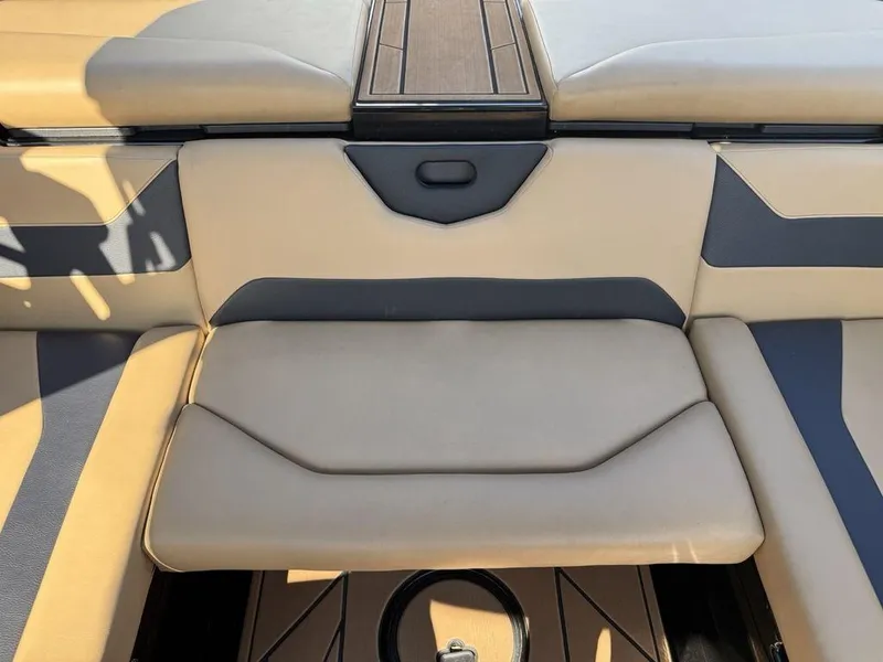 Slide: The Image of 2023 ATX Surf Boats 22 TYPE-S interior seating, beige and gray upholstery. - 14