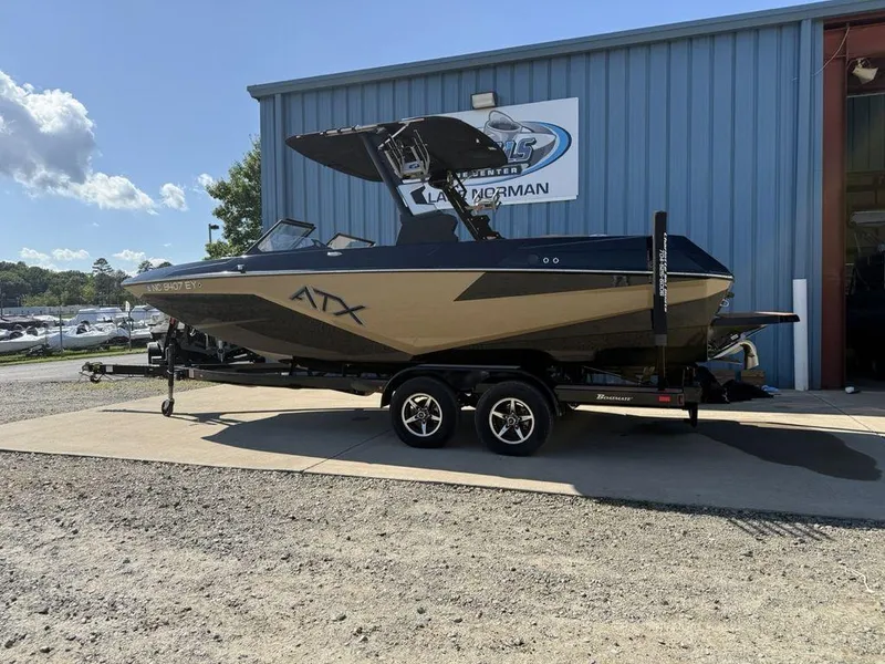 Slide: The Image of 2023 ATX Surf Boats 22 TYPE-S on trailer outside dealership. - 2