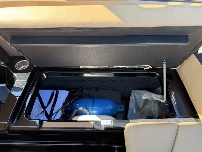 Slide: The Image of 2023 ATX Surf Boats 22 TYPE-S storage compartment with blue fender and accessories. - 21