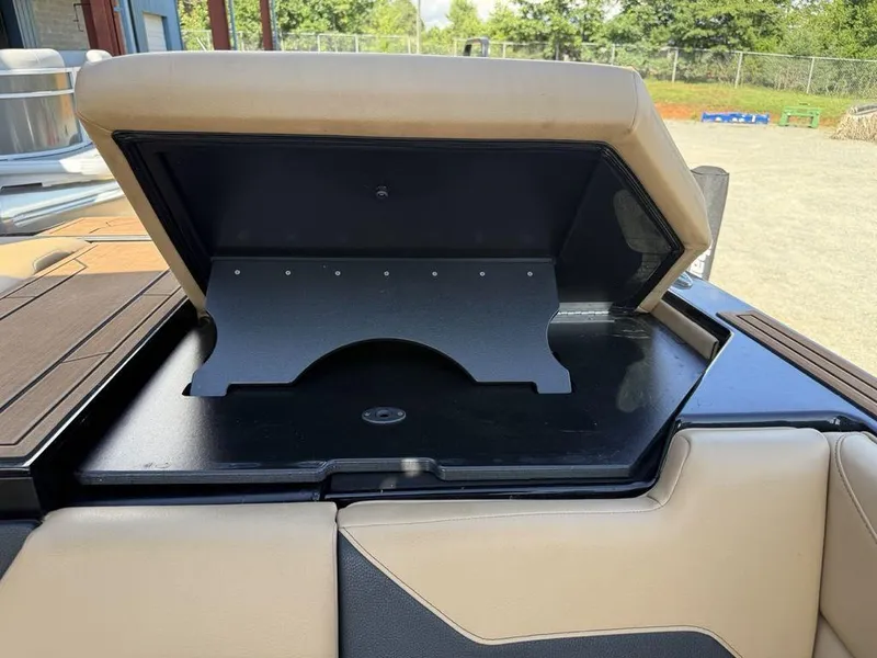 Slide: The Image of 2023 ATX Surf Boats 22 TYPE-S storage compartment with open lid, showcasing interior space. - 30