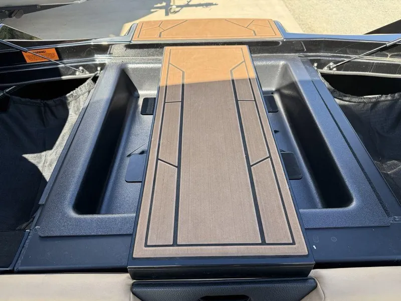 Slide: The Image of 2023 ATX Surf Boats 22 TYPE-S deck with sleek, modern design and wood accents. - 31