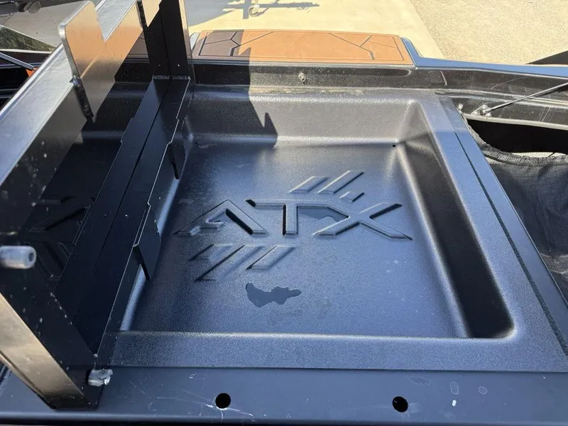 Slide: The Image of 2023 ATX Surf Boats 22 TYPE-S storage compartment with embossed logo. - 32