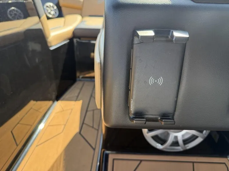 Slide: The Image of 2023 ATX Surf Boats 22 TYPE-S interior with wireless charging pad and premium seating. - 5