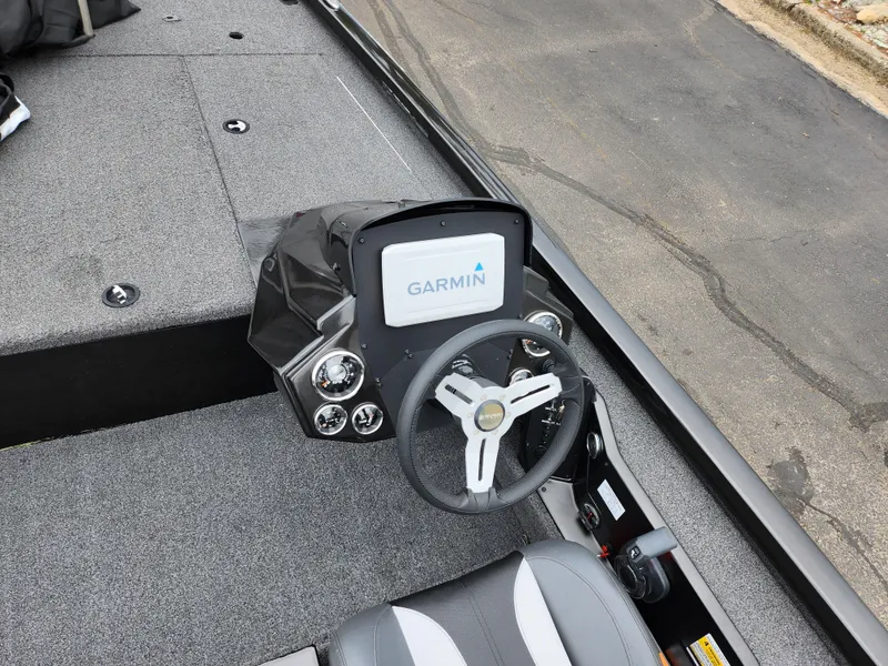 Slide: The Image of 2021 Vexus AVX189 boat dashboard with Garmin display and steering wheel. - 12