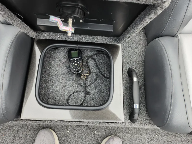 Slide: The Image of 2021 Vexus AVX189 boat interior with storage compartment and electronic device. - 22