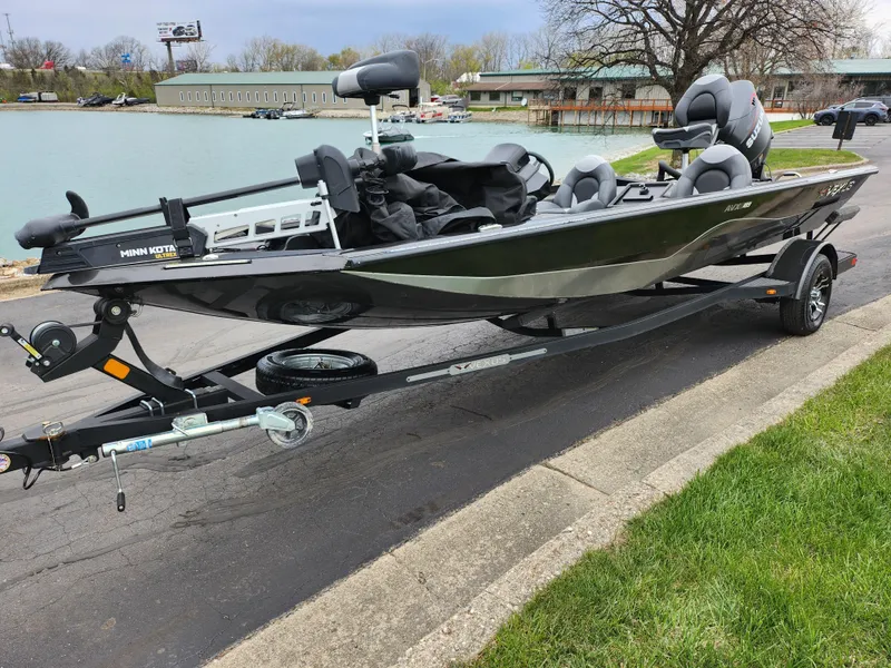 Slide: The Image of 2021 Vexus AVX189 boat on trailer by a lakeside road. - 9